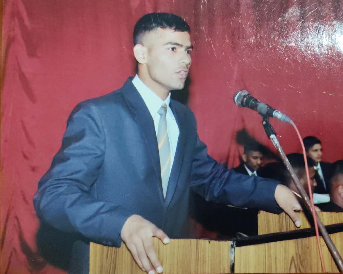 Student speaking at a podium